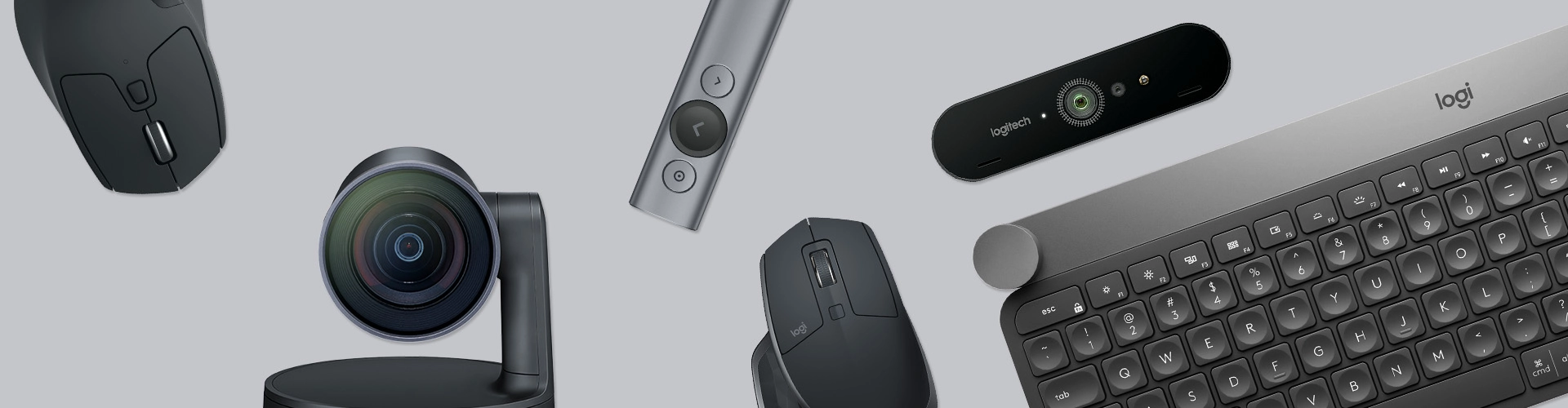 Tastatur, Kameras und Mäuse auf grauen Hintergrund